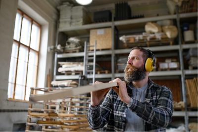 Woodworker with ear protection